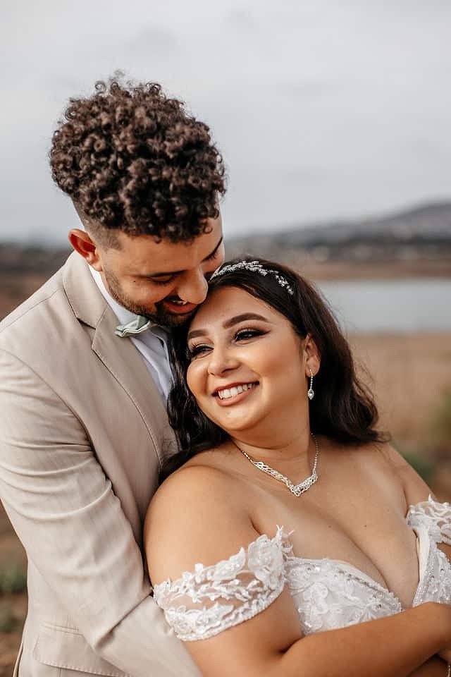 wonderful couple wearing a beautiful smile, strapless wedding dress