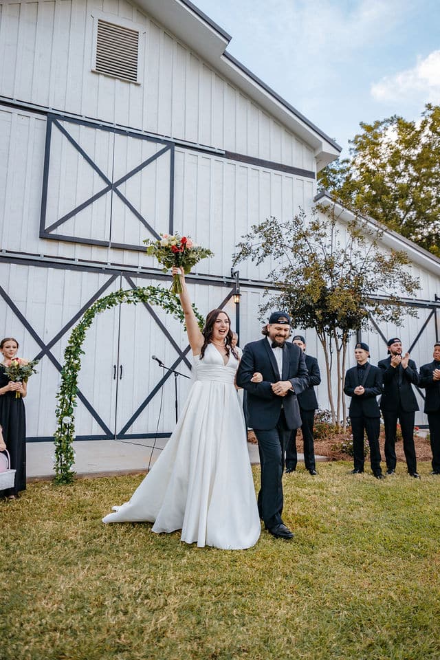 wedding party outside a barn venue