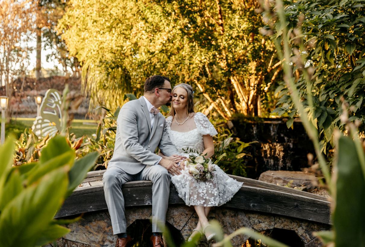 groom kissing her beautiful wife